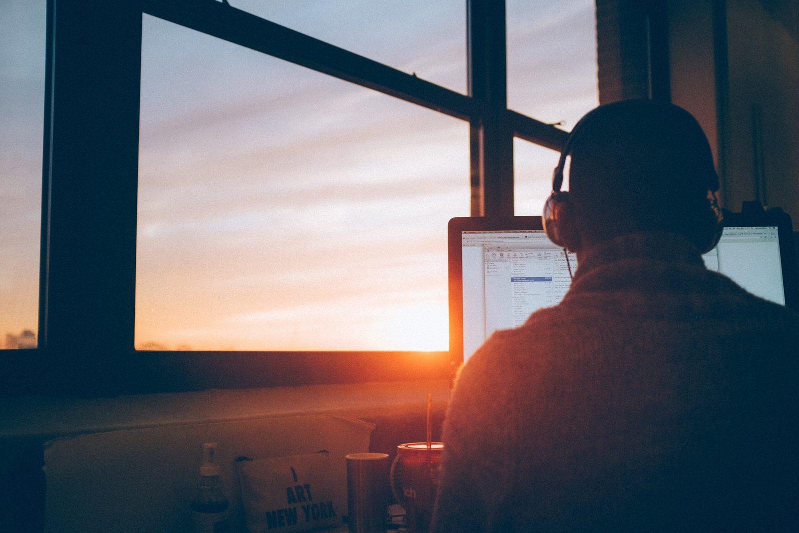 Support agent wearing a headset at a workstation